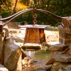 Copper lantern over a pond by Archive Designs